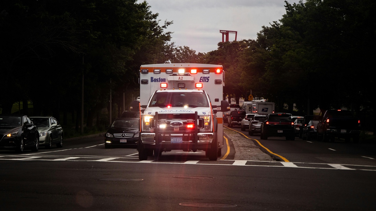 Ambulance and fire truck outside a New Hampshire town hall illustrating emergency services.