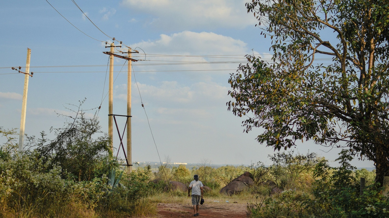 Rooftop solar panels near a developing neighborhood in Juba, hinting at renewable energy adoption.