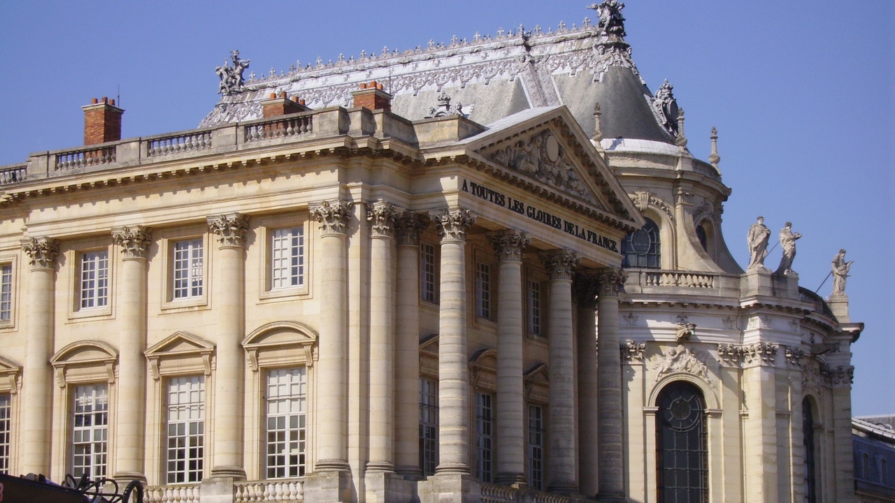 Aerial view of the Palace of Versailles and its formal gardens