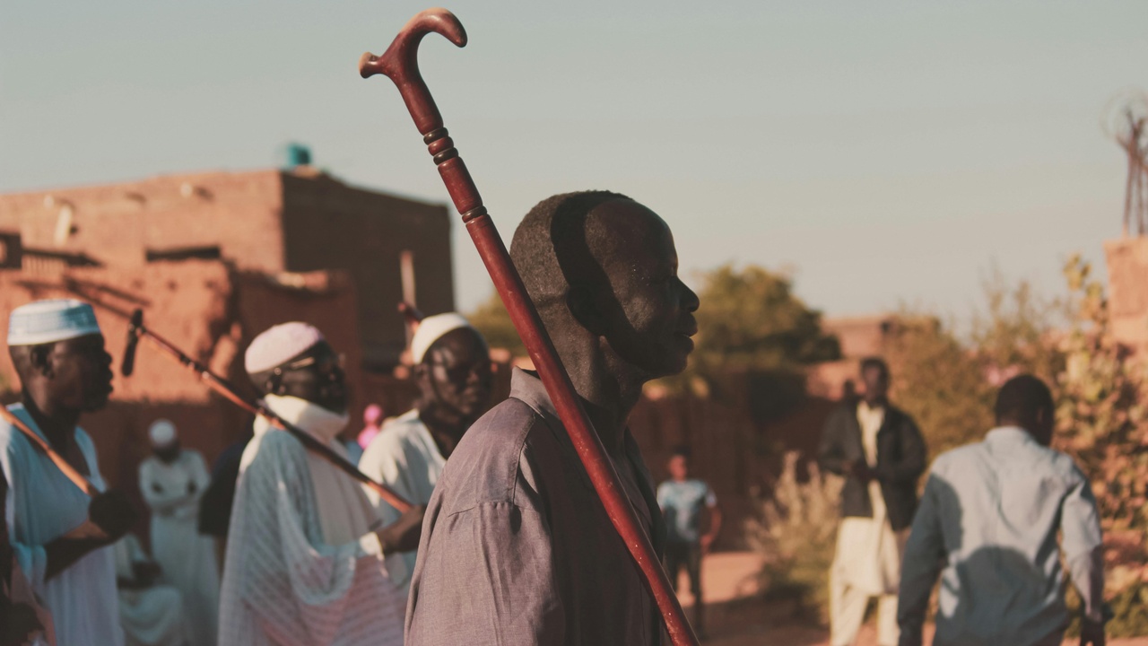 Guesthouse courtyard and market scene in Khartoum