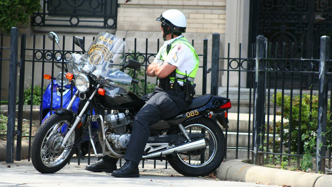 Police cruiser on a New Hampshire main street representing low local crime rates.