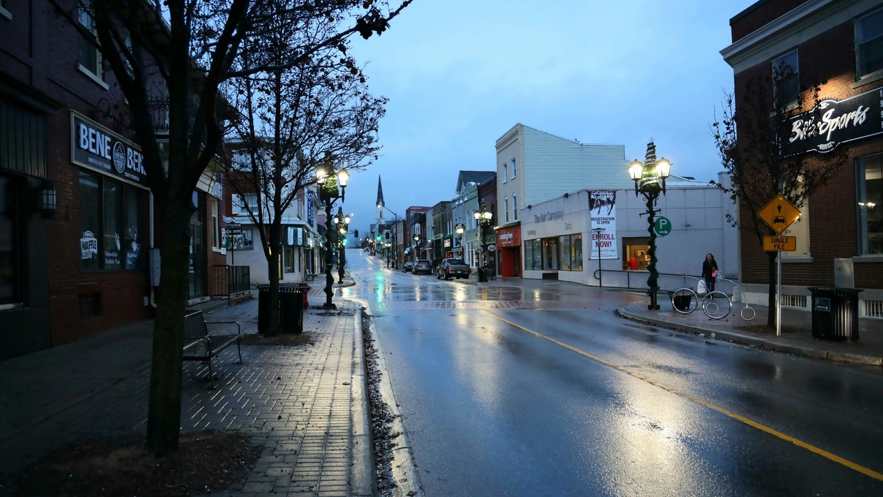 Family walking in a safe New Hampshire downtown with community resources visible.