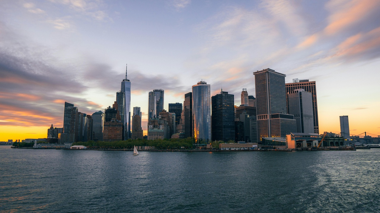 Kayakers near Pier 26 with Manhattan skyline at sunset