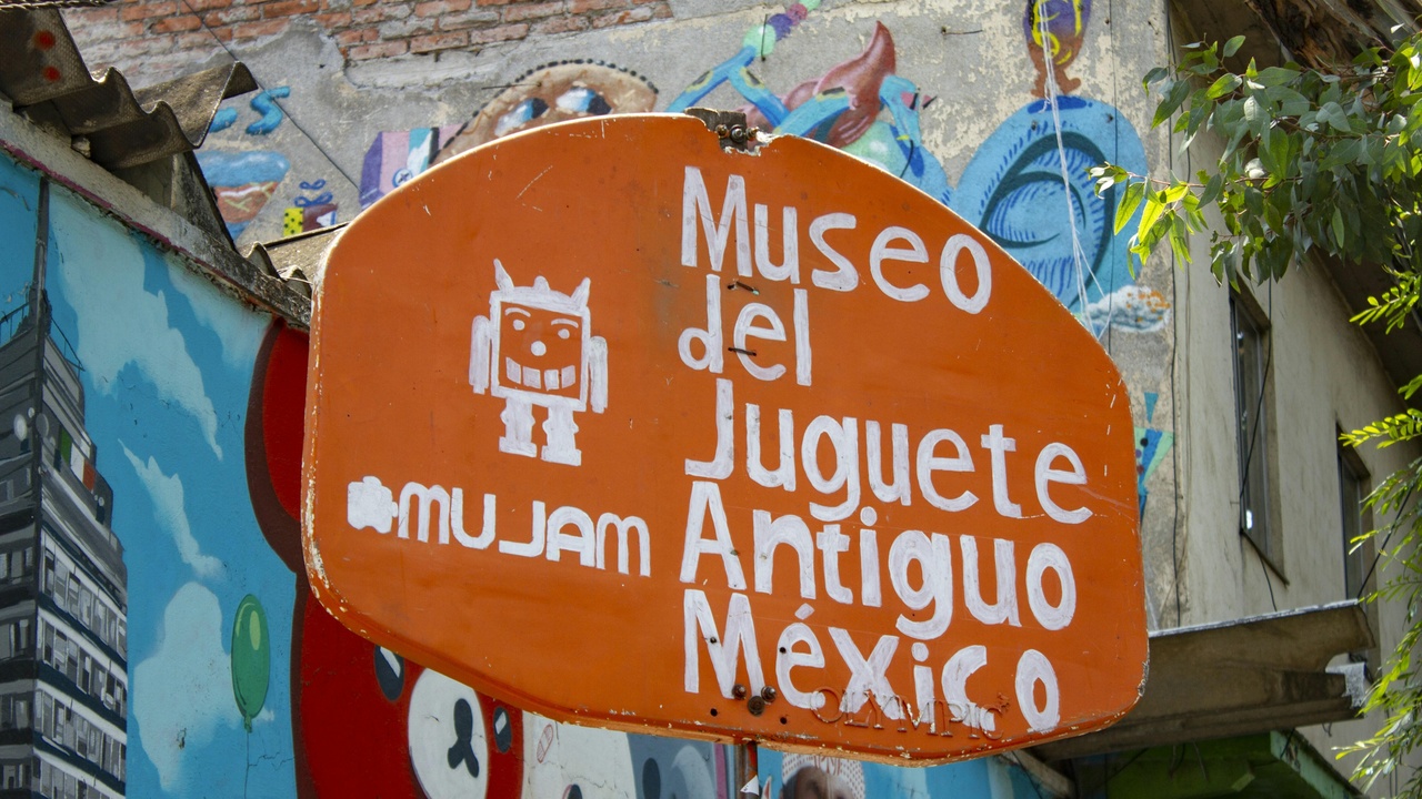 Traveler hiking in Copper Canyon with a train in the distance
