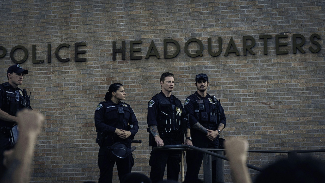Street scene in a border or commuter town with police presence