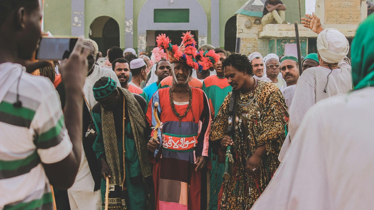 Traditional Nigerian wedding with colorful attire and family elders present