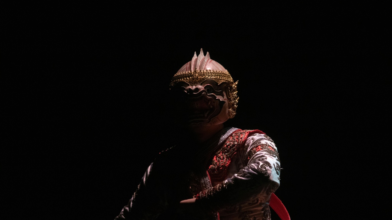 Fang ceremonial dancers wearing traditional masks during a ritual on the mainland