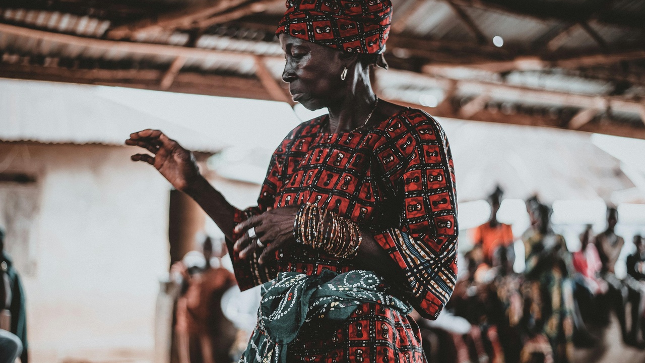 Market scene with traditional textiles and street food in Nigeria