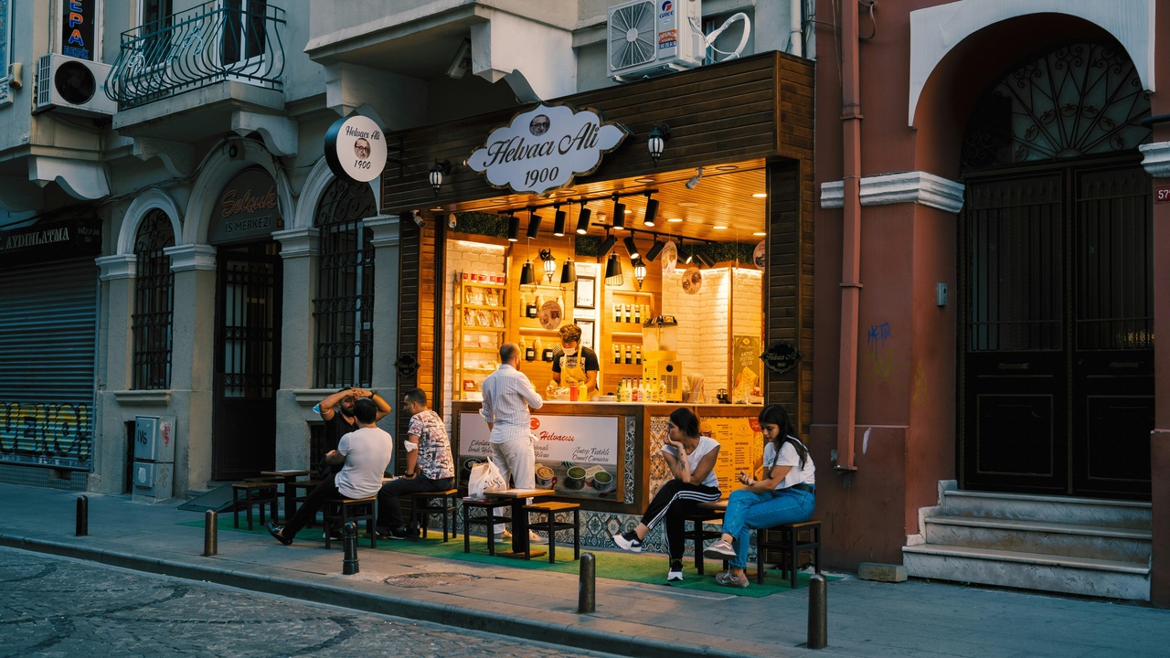 Outdoor café on Tkalčićeva Street with patrons enjoying coffee.