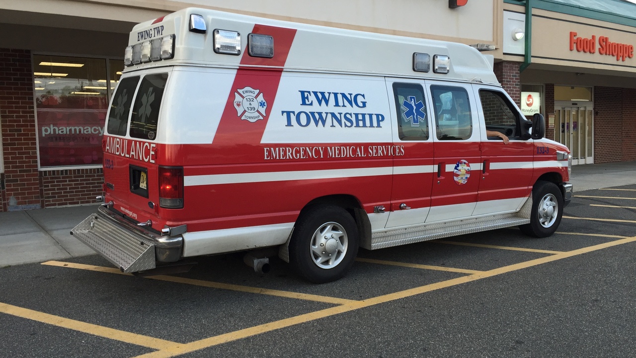 Fire and EMS station with ambulance and well-lit streets in a New Jersey town