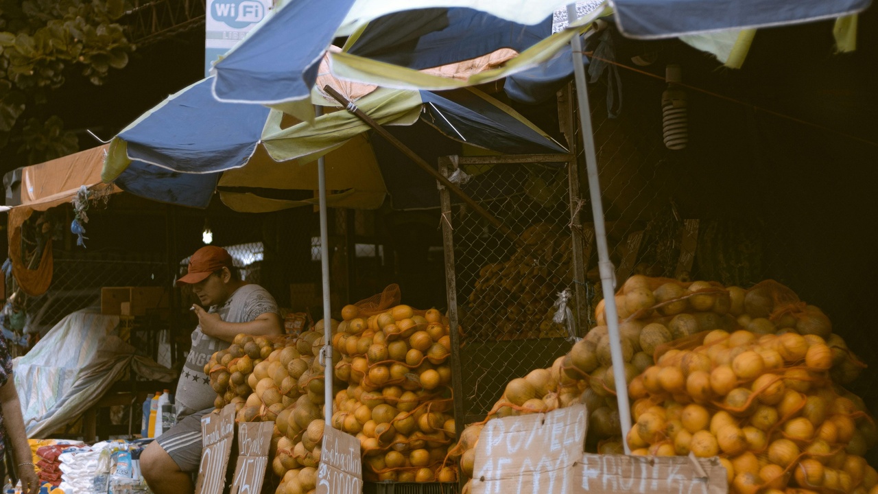 Busy market in Concepción with trucks and vendors