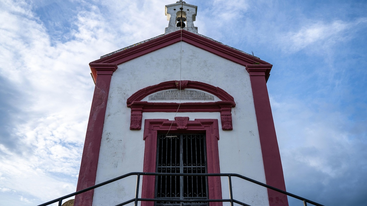 Hikers on a rocky trail overlooking Banderas Bay and the city skyline
