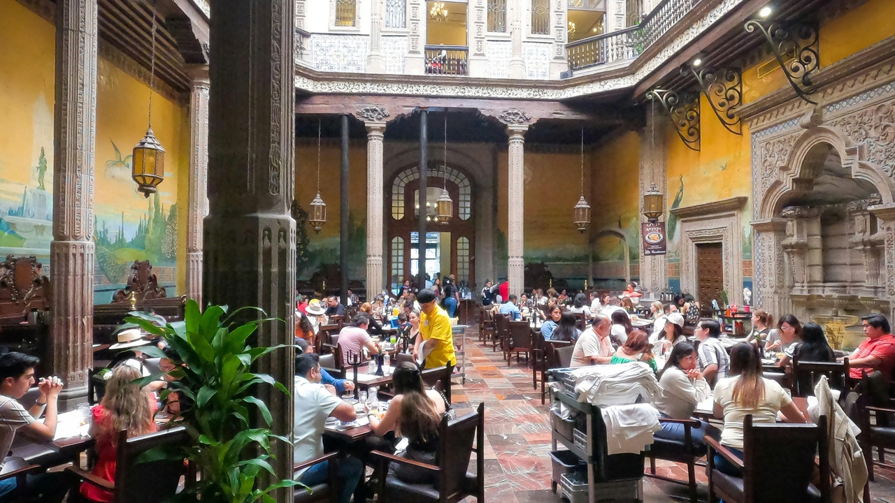 Interior of a Cuban paladar with diners enjoying local food