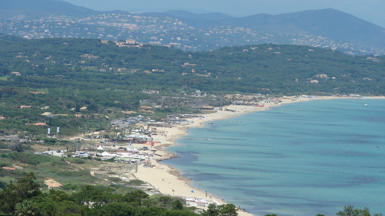 Pampelonne Beach shoreline with umbrellas and Mediterranean sea