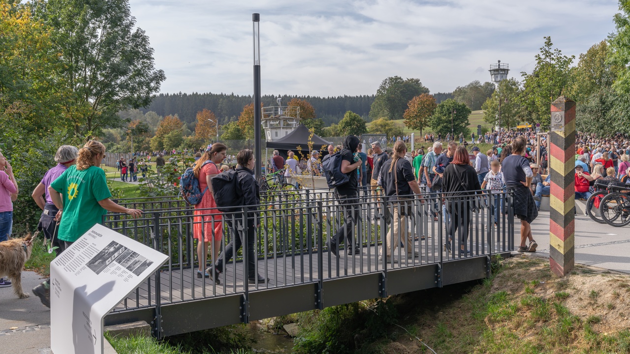 Refugees walking along a dusty road near the CAR border.