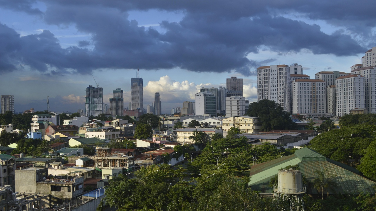Metro Manila street at night with police patrol