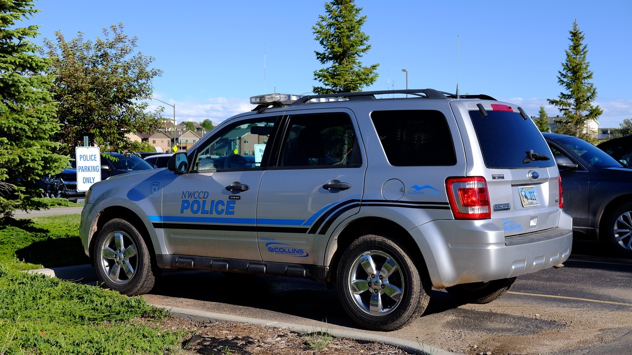 Police officers and community members at a neighborhood watch meeting in a Wyoming town