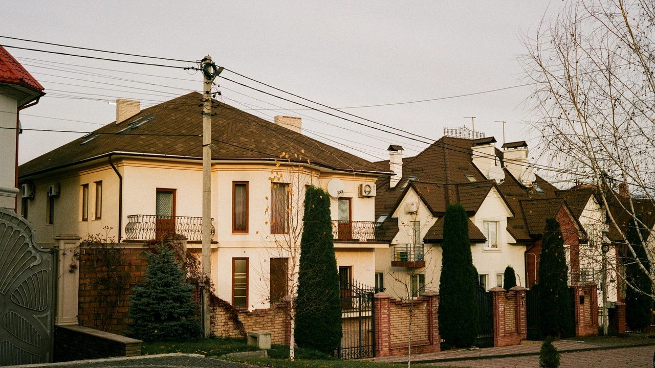 Row of houses in Ericeira with coastal views, illustrating local housing market