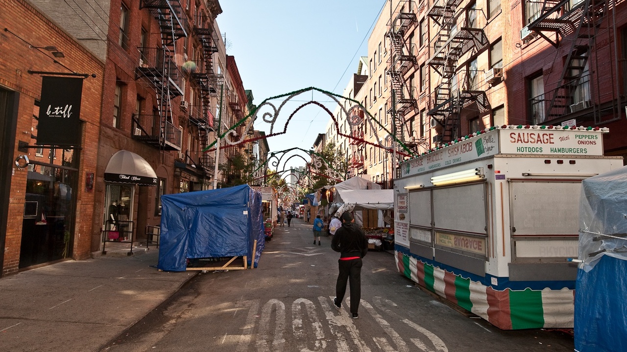 Religious procession in an Italian town with citizens and clergy