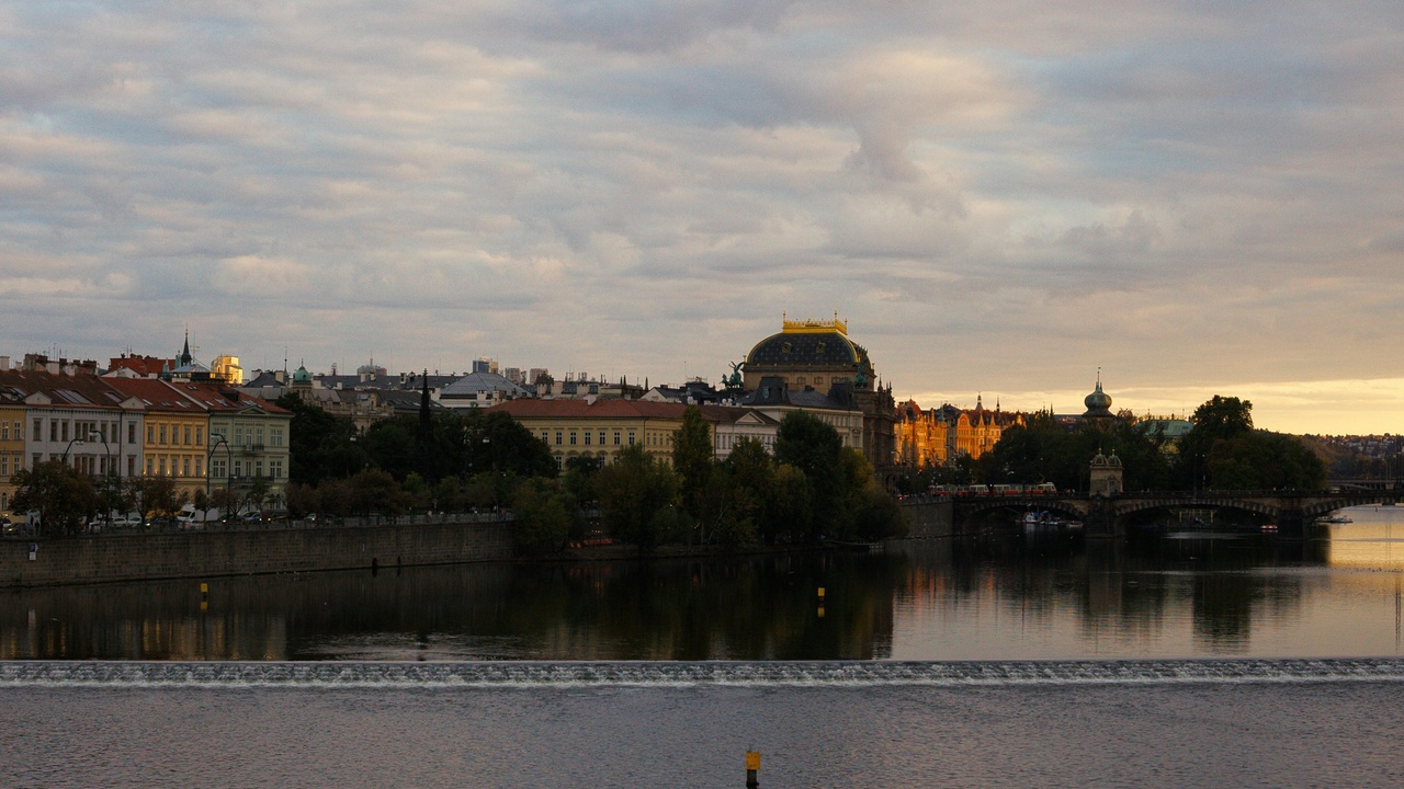 Prague skyline at dusk with Prague Castle and Charles Bridge