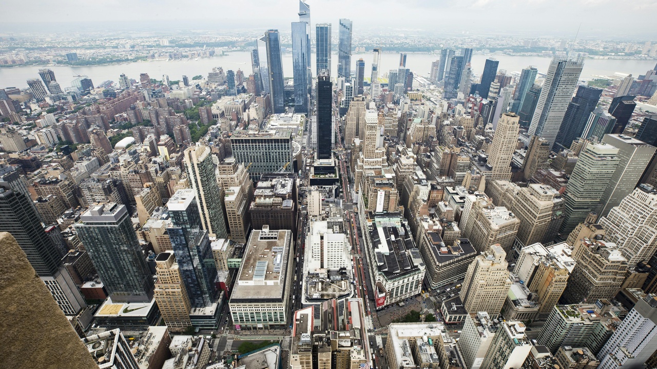 Wall Street skyline and Silicon Valley campus representing U.S. economy and innovation
