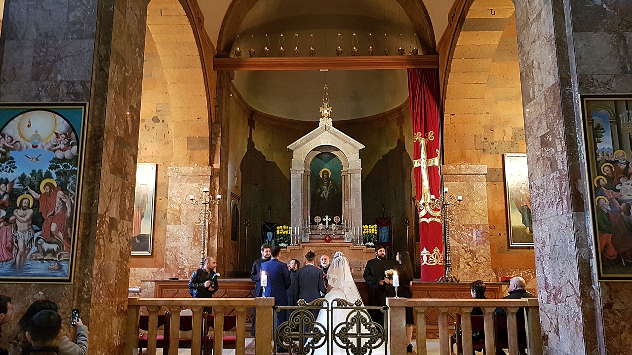 Armenian wedding celebration with dancers and a large family table