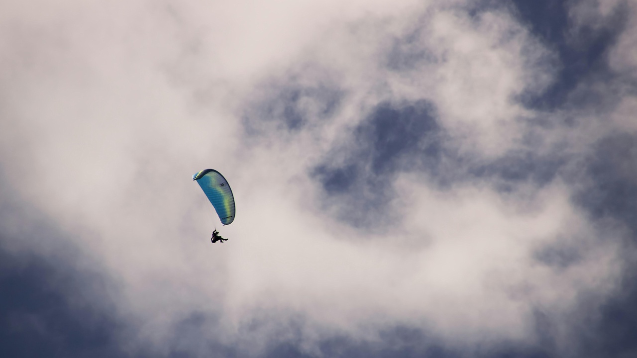 Paraglider launching above the Bay of Kotor with the old town below
