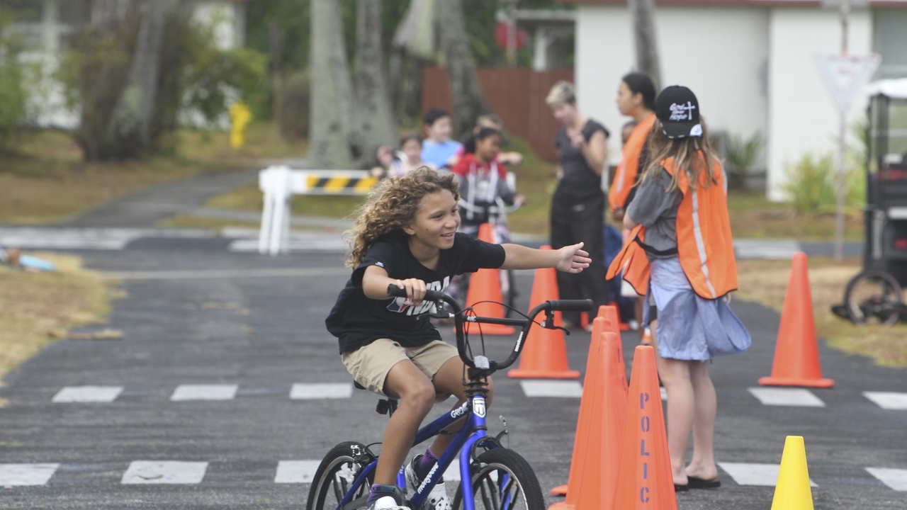 Clinic and small boat transport illustrating healthcare and supply challenges on a Marshall Islands atoll