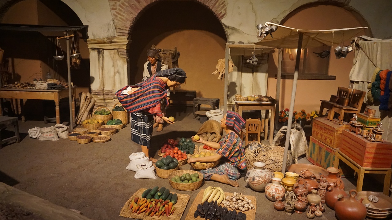 Stalls at Mercado Central with colorful textiles and street-food vendors