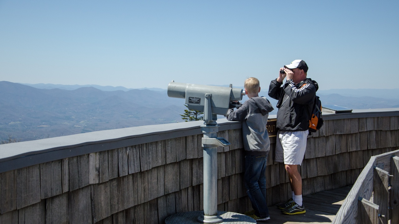 Hikers on a ridge in the North Georgia mountains with distant peaks