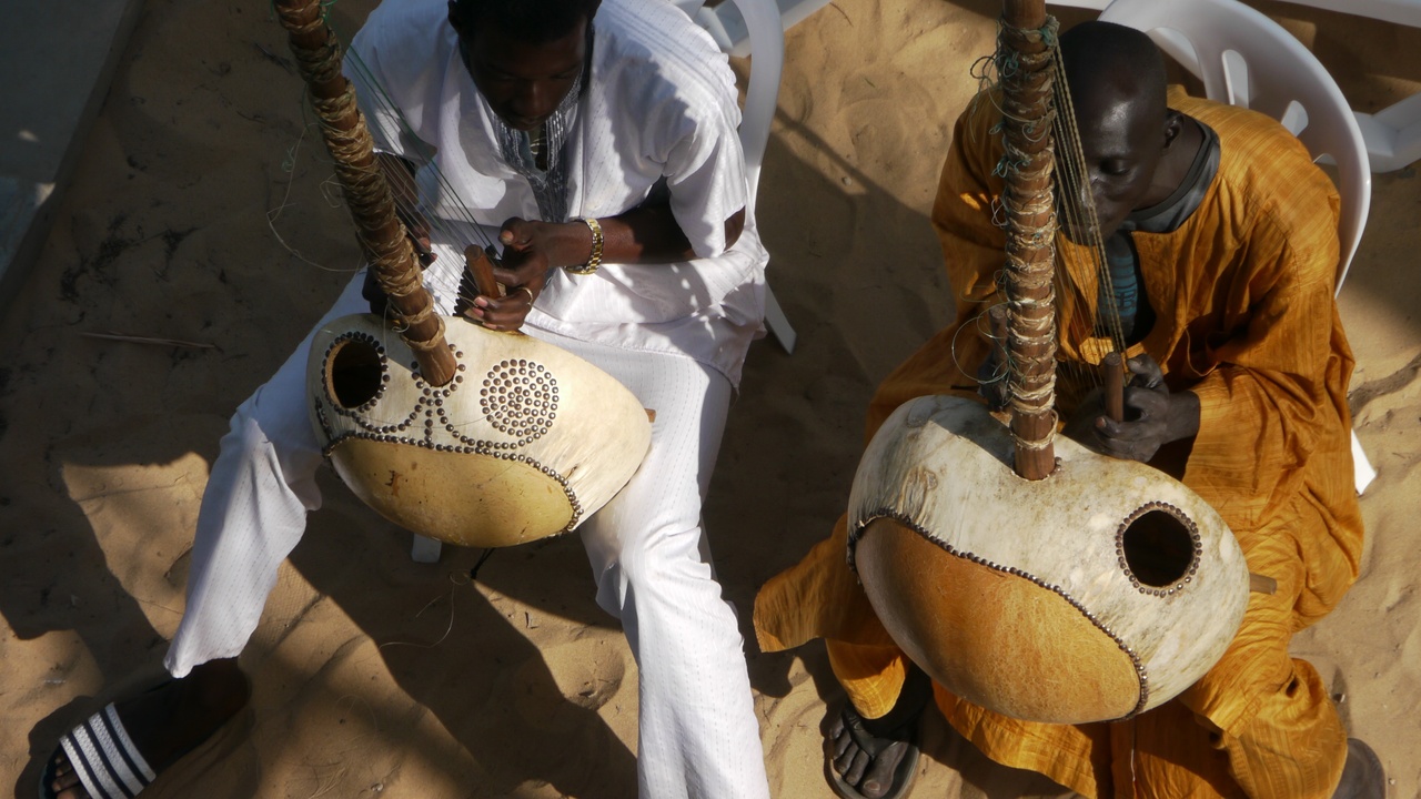 Gambian kora player performing at a festival