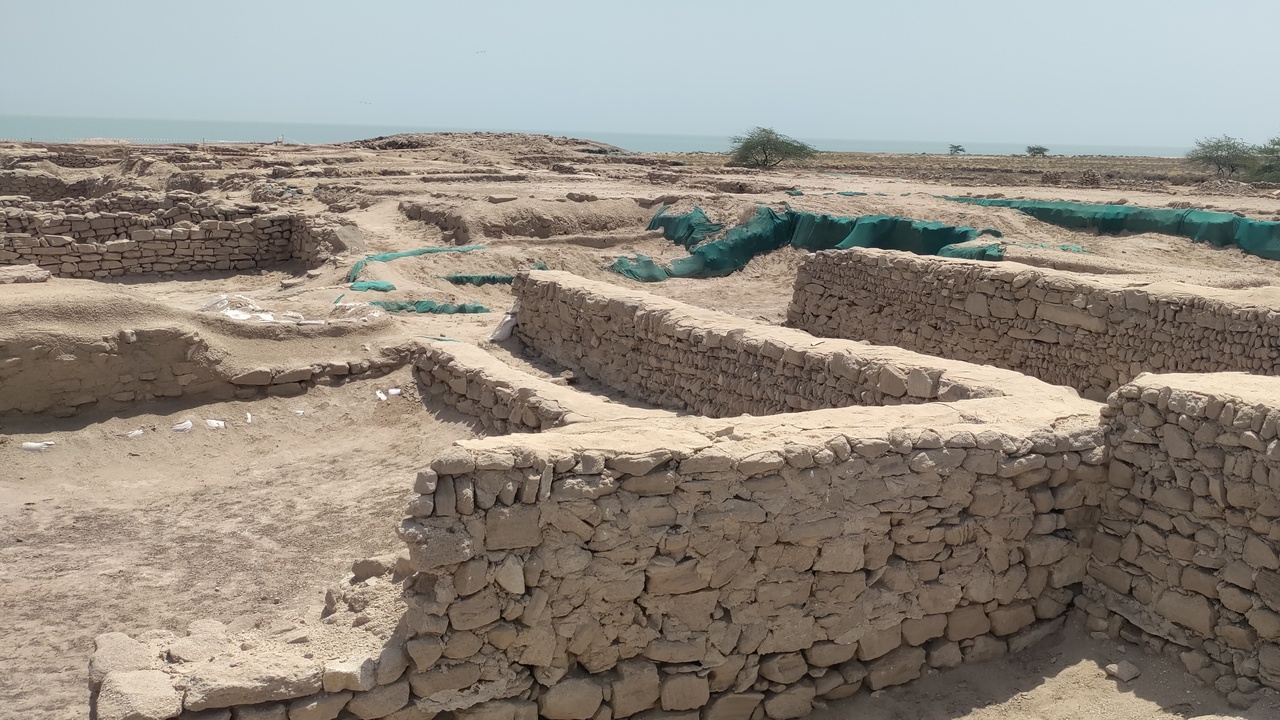 island archaeology and coastal green spaces with dunes or waterfront parks