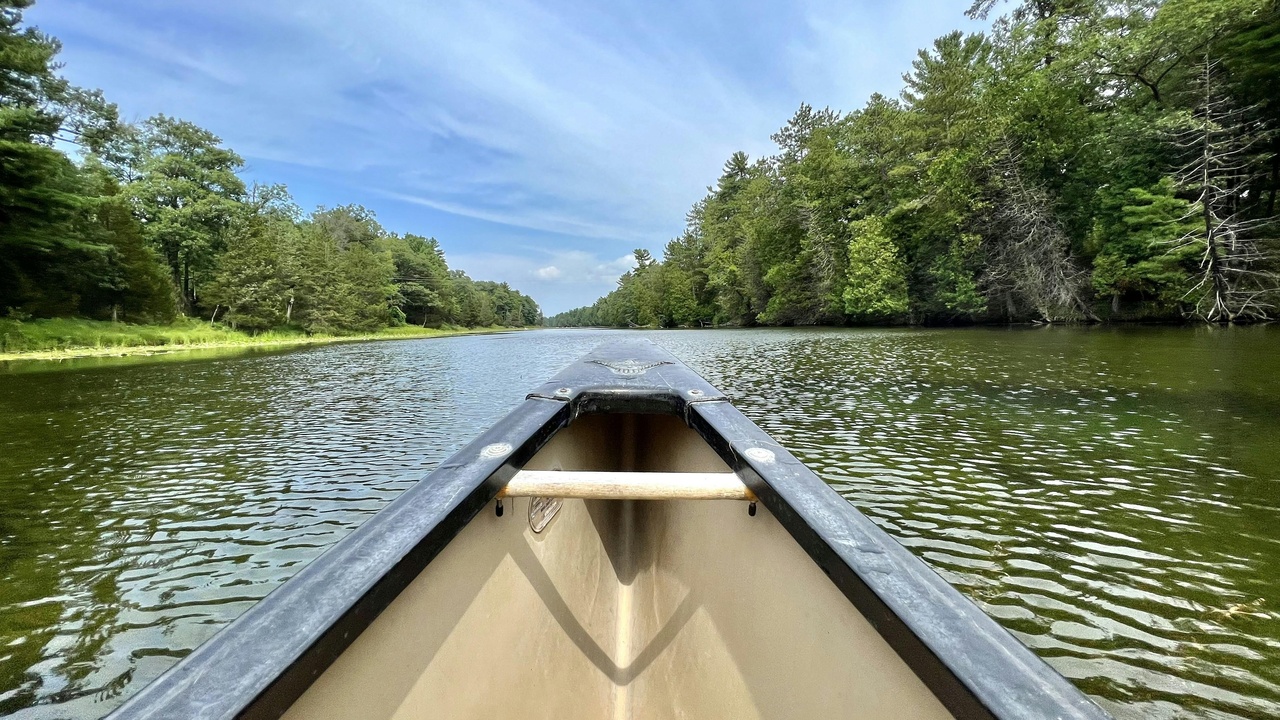 Hiker overlooking a Superior Hiking Trail ridgeline on the North Shore