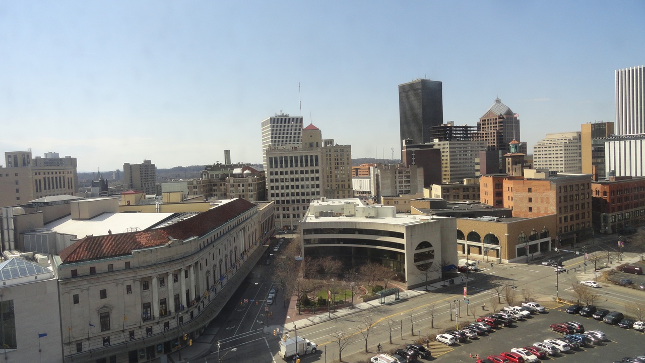 Rochester skyline and neighborhood streets illustrating upstate urban centers with elevated crime