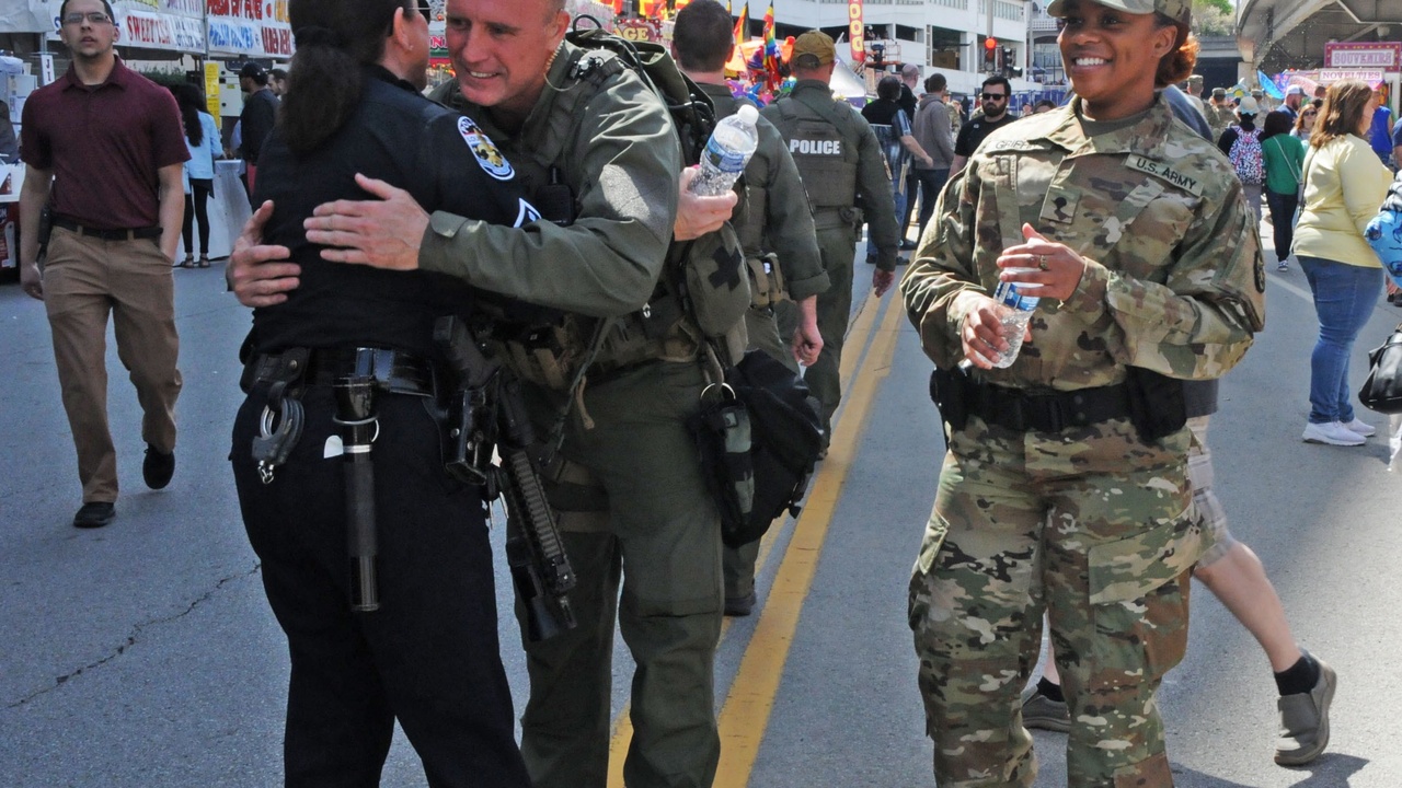 Louisville skyline at dusk with police patrols—illustrating urban crime challenges in Kentucky