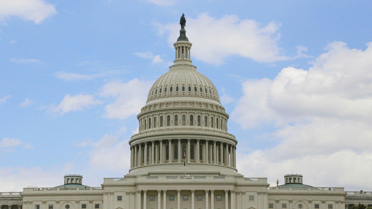 U.S. Capitol building and American flag representing institutions and international role