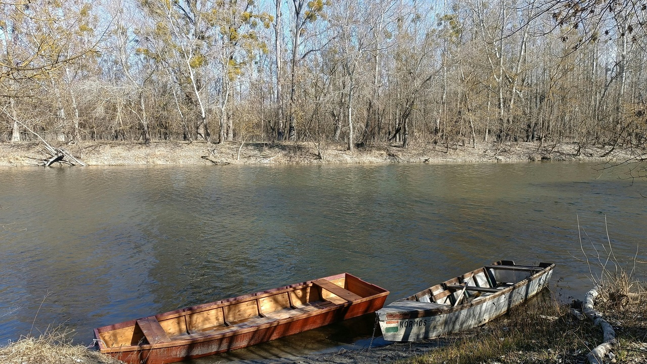 Canoe on the Buffalo National River with limestone bluffs