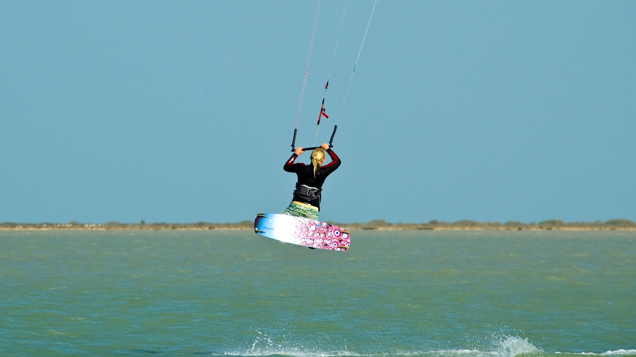 Kitesurfers off a Mediterranean beach in Tunisia