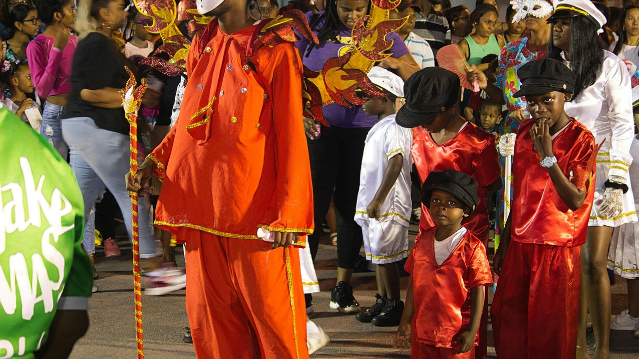 Community market and cultural celebration showing Liberian social life
