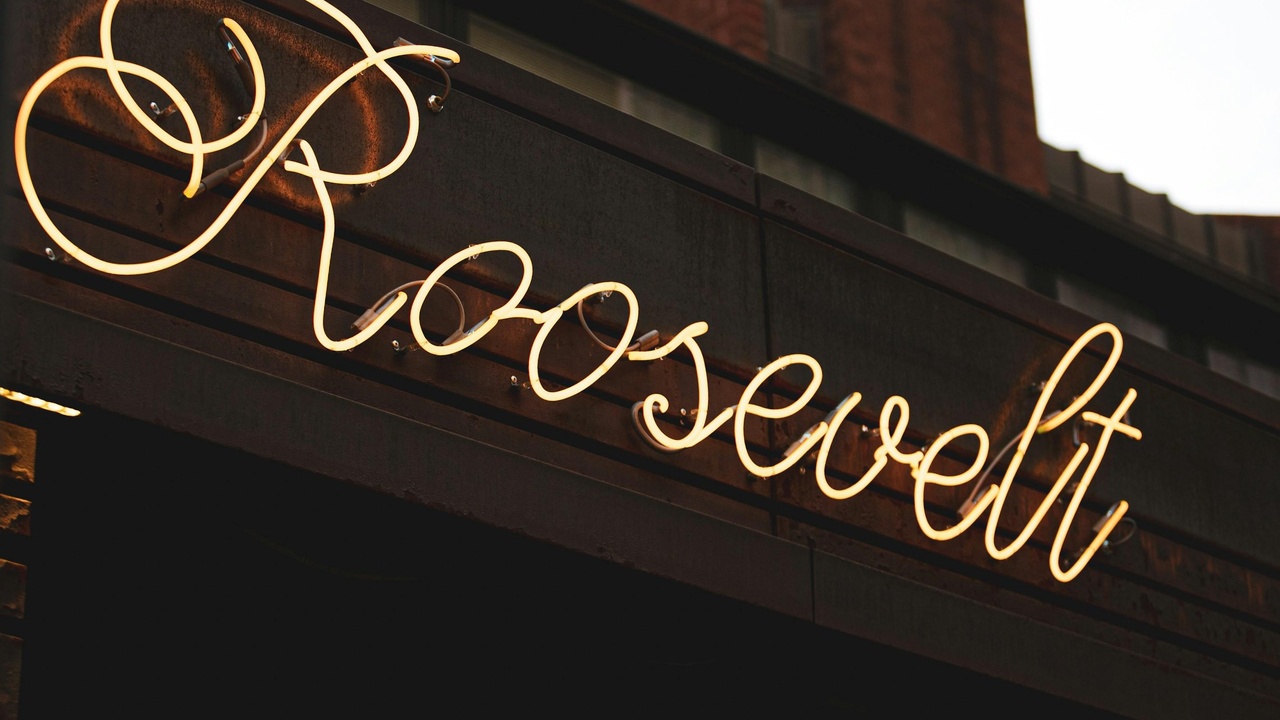 Lowertown St. Paul streets with restaurants and outdoor seating in the evening.
