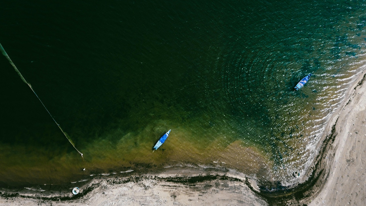 Zipline over Lake Travis with cliffs and blue water below