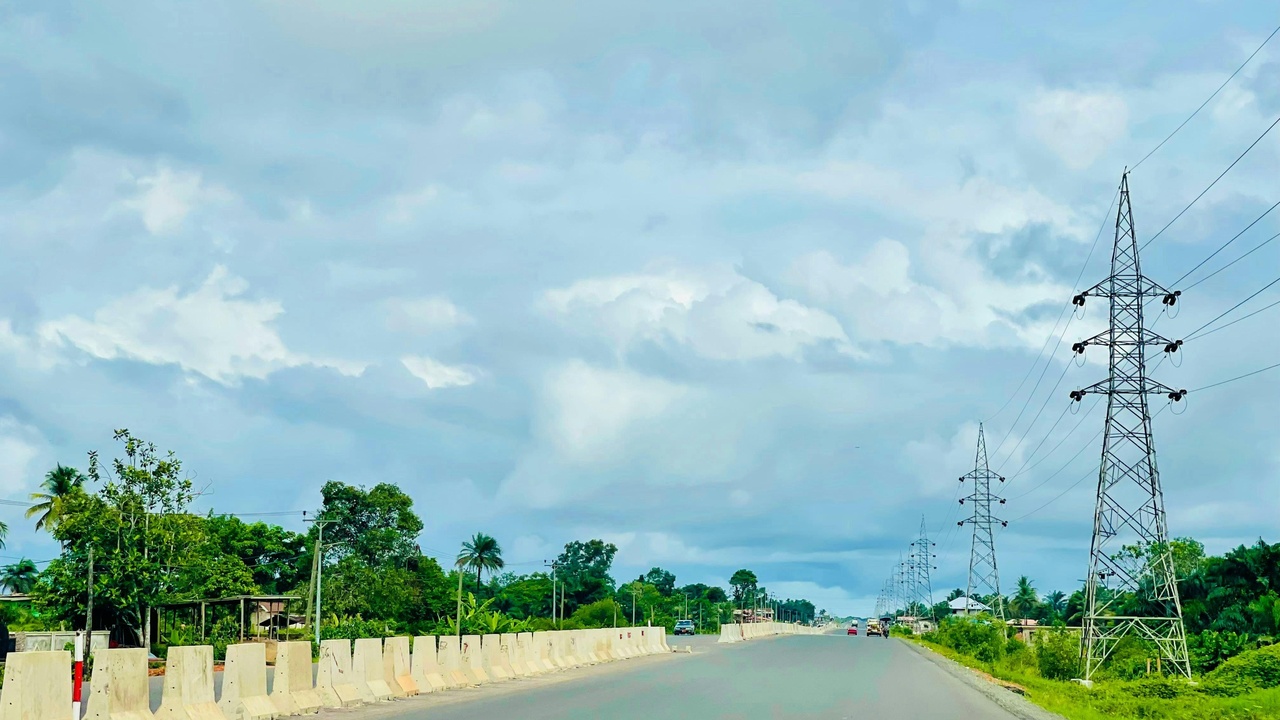 Healthcare clinic and roadworks representing development projects in Liberia