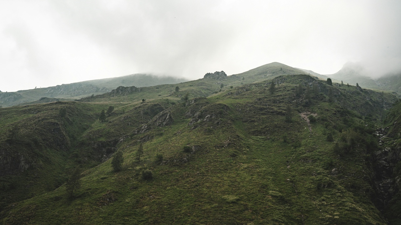 Hiker on a Maloti Mountains ridge with expansive highland views