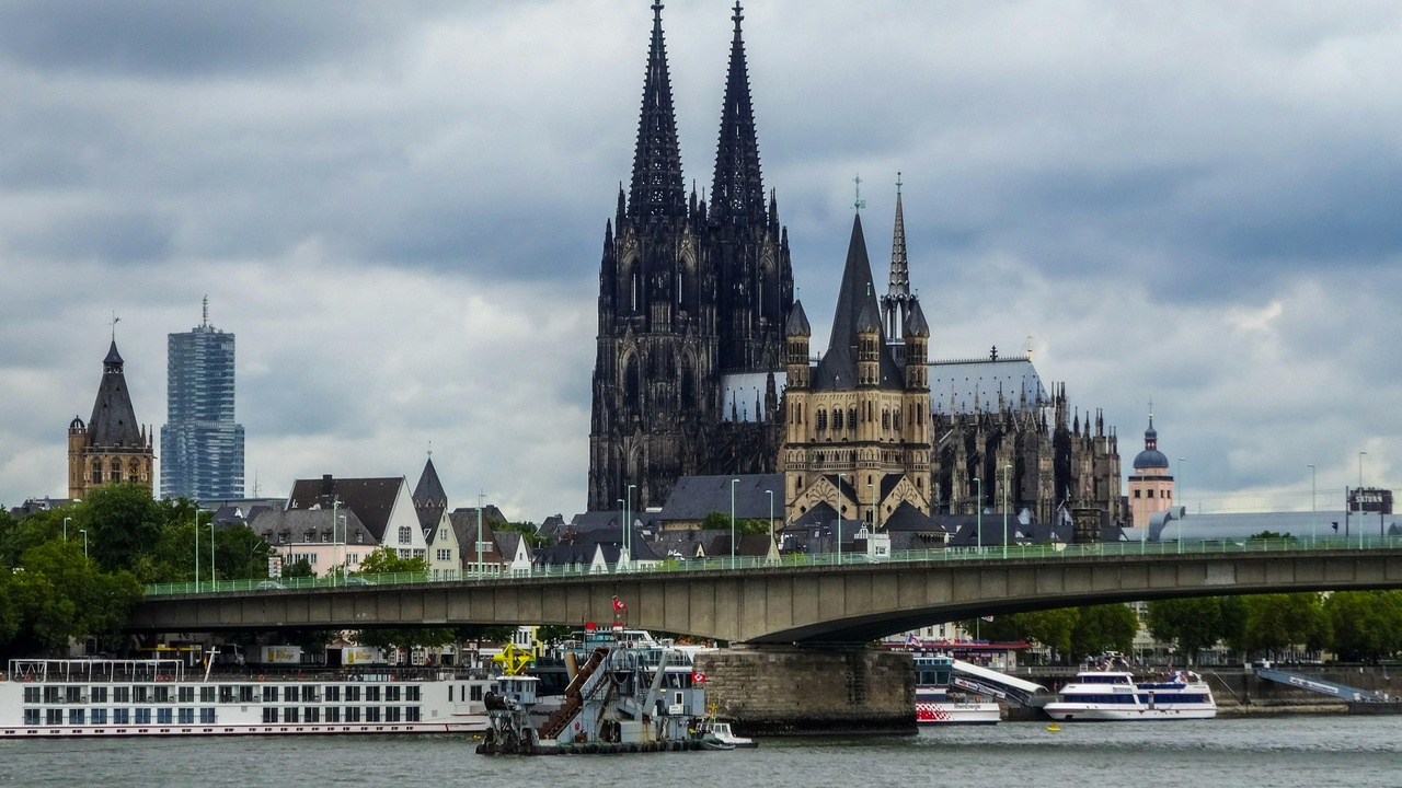 River cruise boat on the Rhine passing the Cologne skyline