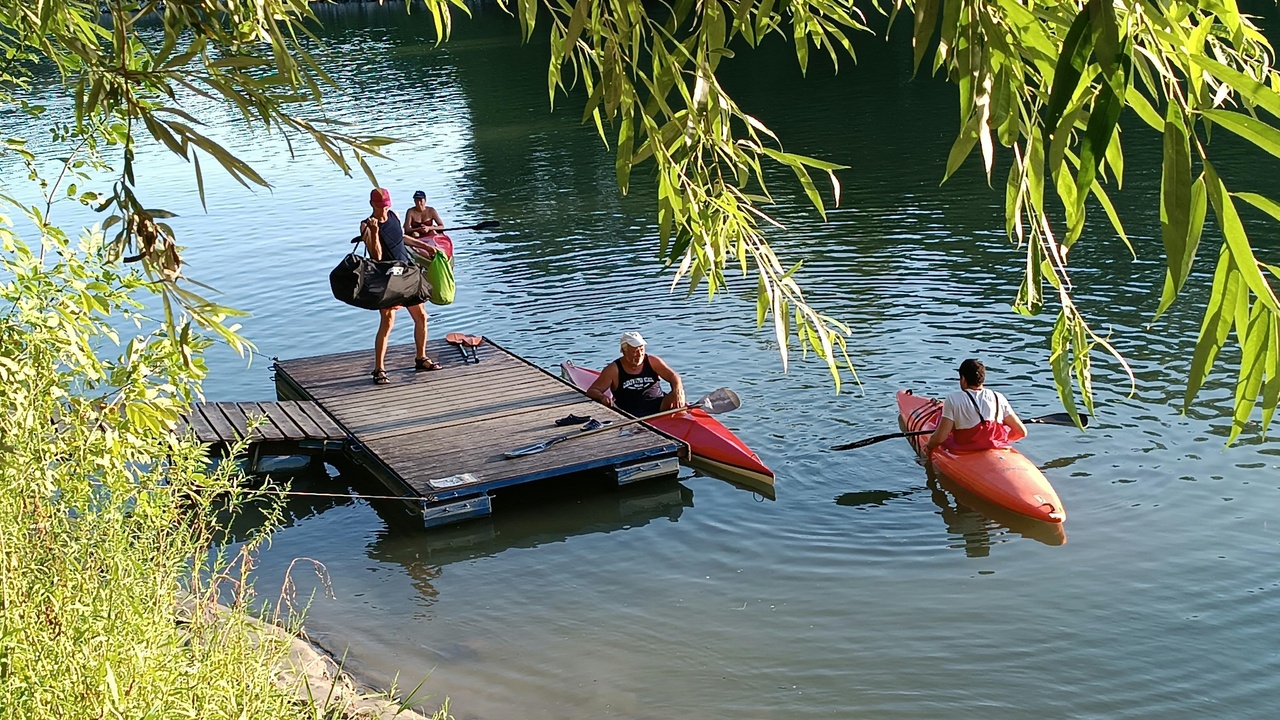 Rafting on a narrow river gorge in Tajikistan with steep cliffs