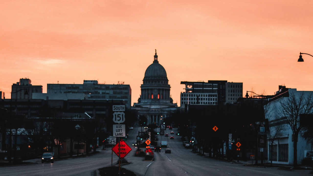 Downtown of a smaller Wisconsin city showing streets and businesses; illustrates small-city crime patterns in Wisconsin.