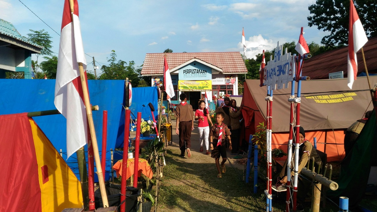 Dancers and decorated barges at a Zambian festival