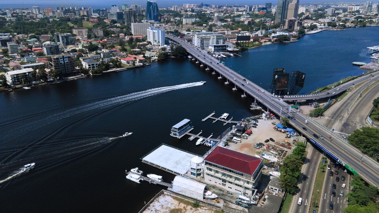 Lagos commercial skyline and busy market illustrating economic activity