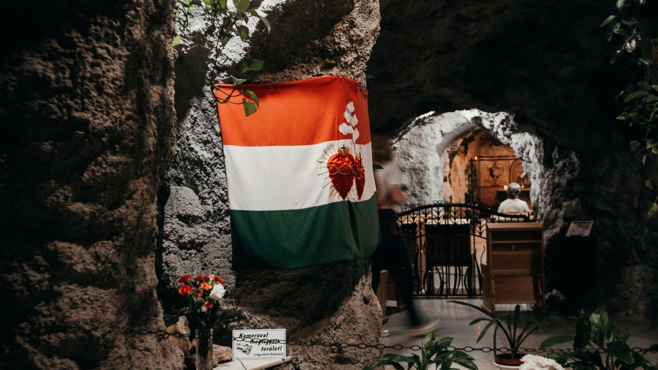 Family celebrating a Hungarian name-day with flowers and cake
