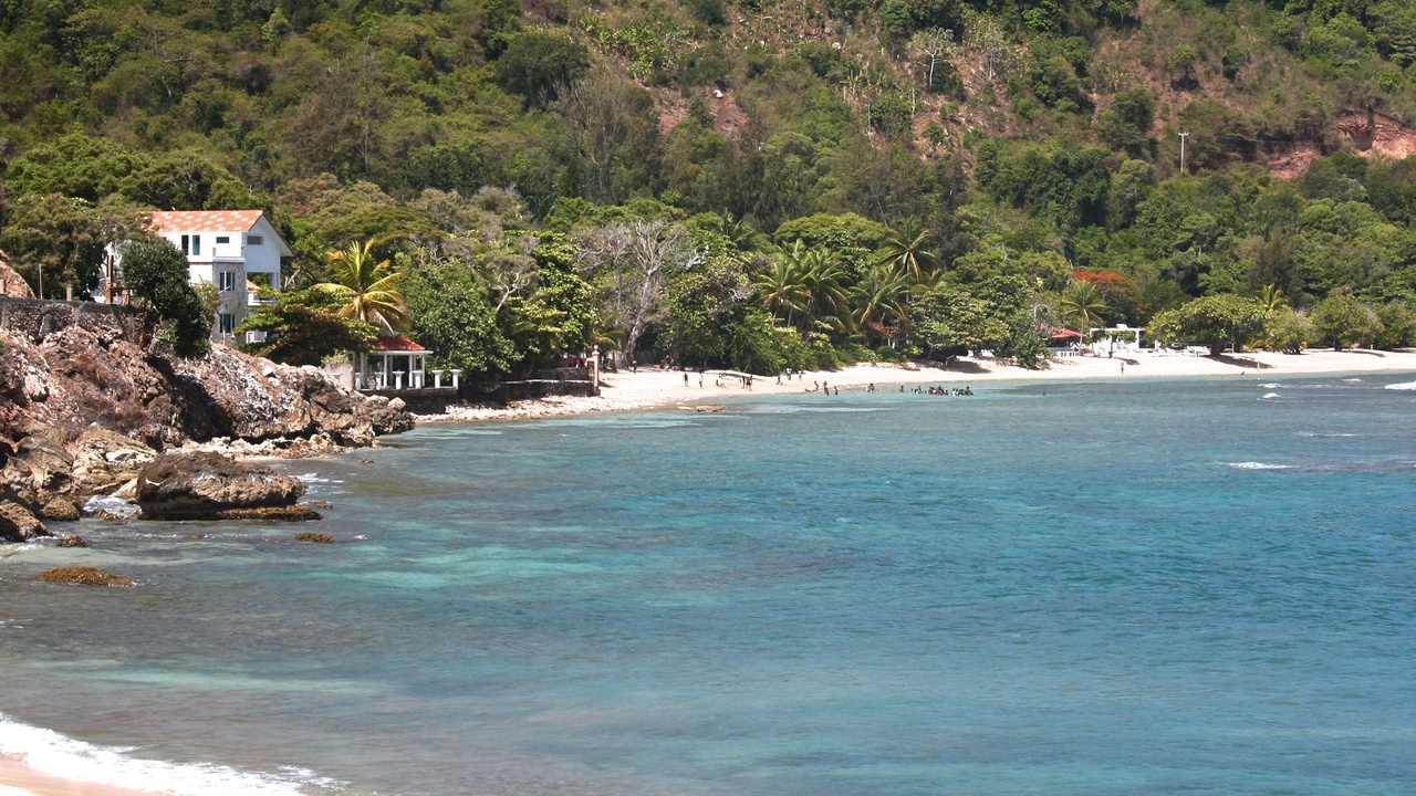 Haitian coastal landscape with beach and fishing boats